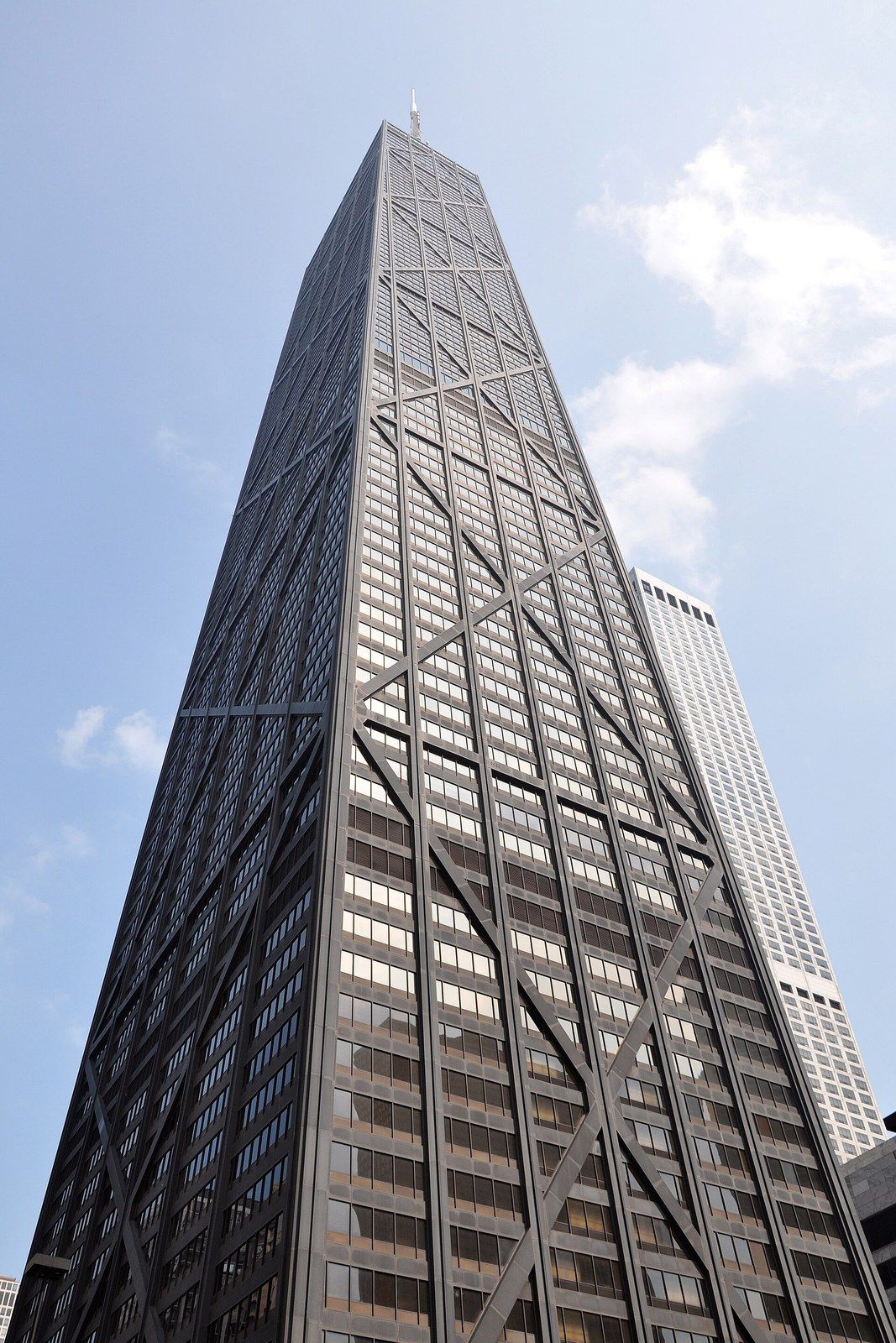 Looking up a tapering black tower with large exterior X braces, a Wikimedia Commons photograph in Michael Stern's encyclopedia