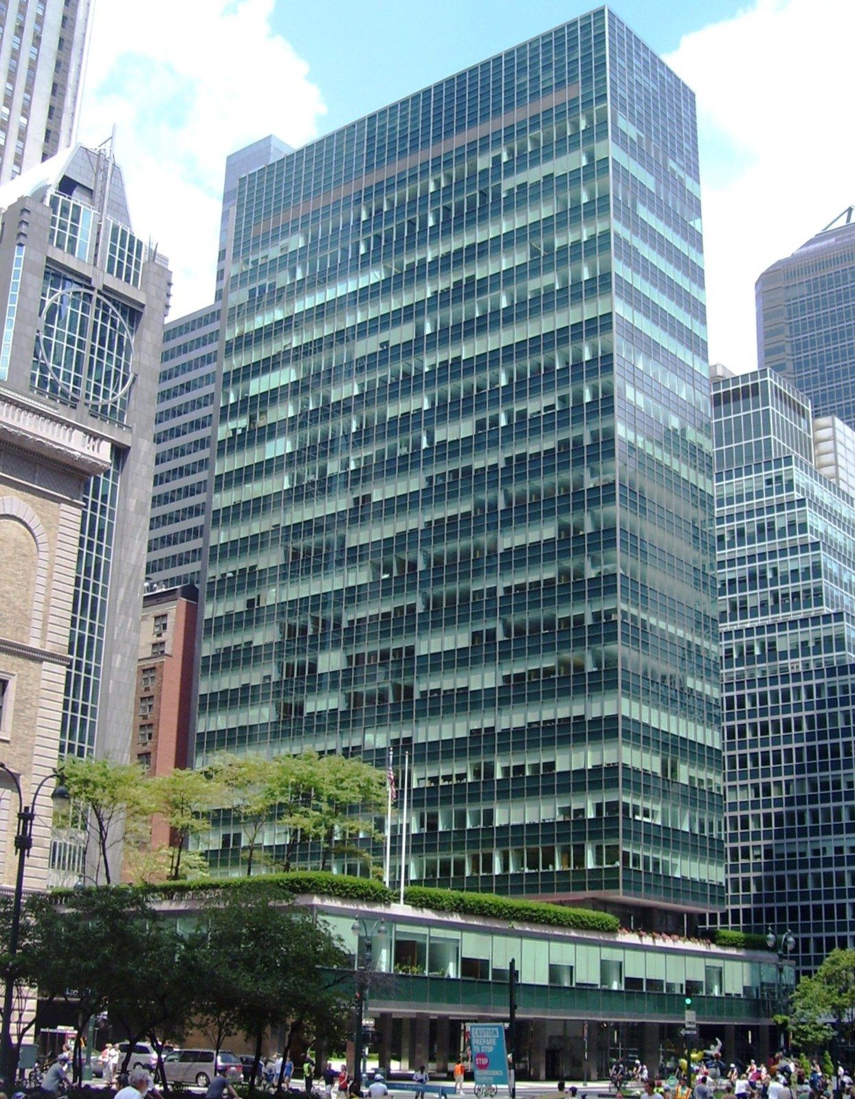 A green glass slab office building on a podium seen from across an avenue, a Wikimedia Commons photograph in Michael Stern's encyclopedia