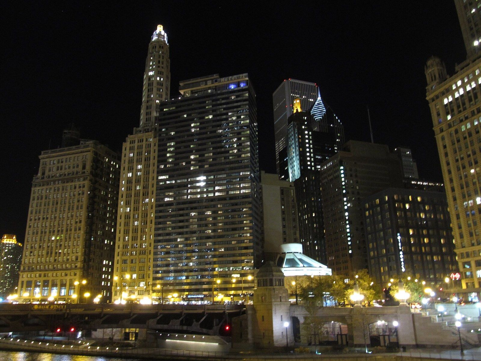 Riverside office towers lit at night with a bridge in the foreground, a Wikimedia Commons photograph in Michael Stern's encyclopedia