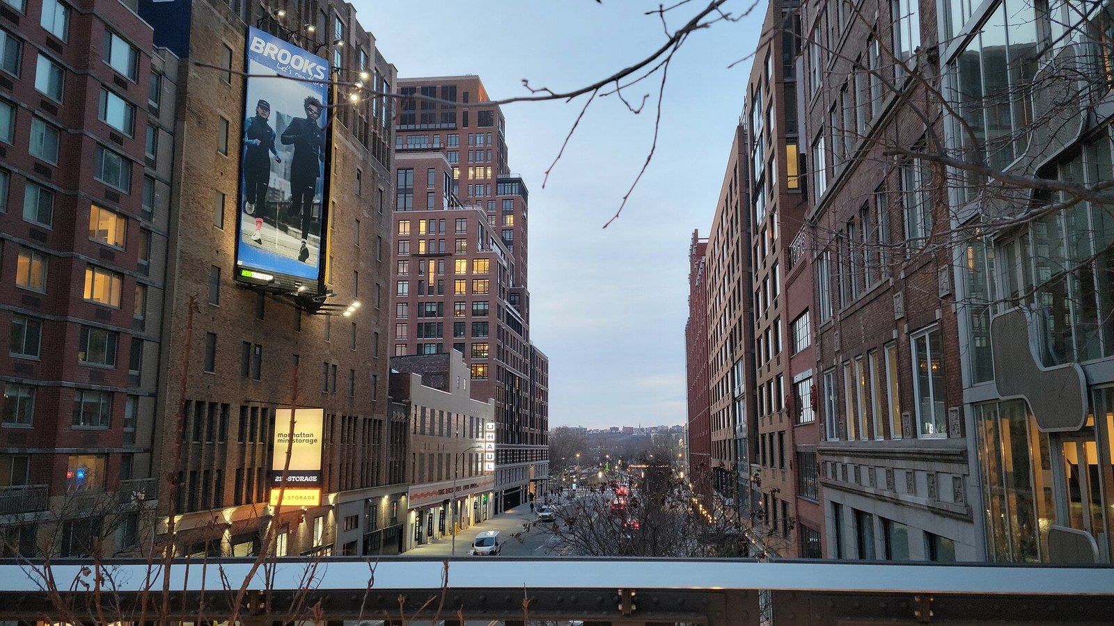 A view along an elevated park toward the river with brick and glass buildings on both sides, a Wikimedia Commons photograph in Michael Stern's encyclopedia