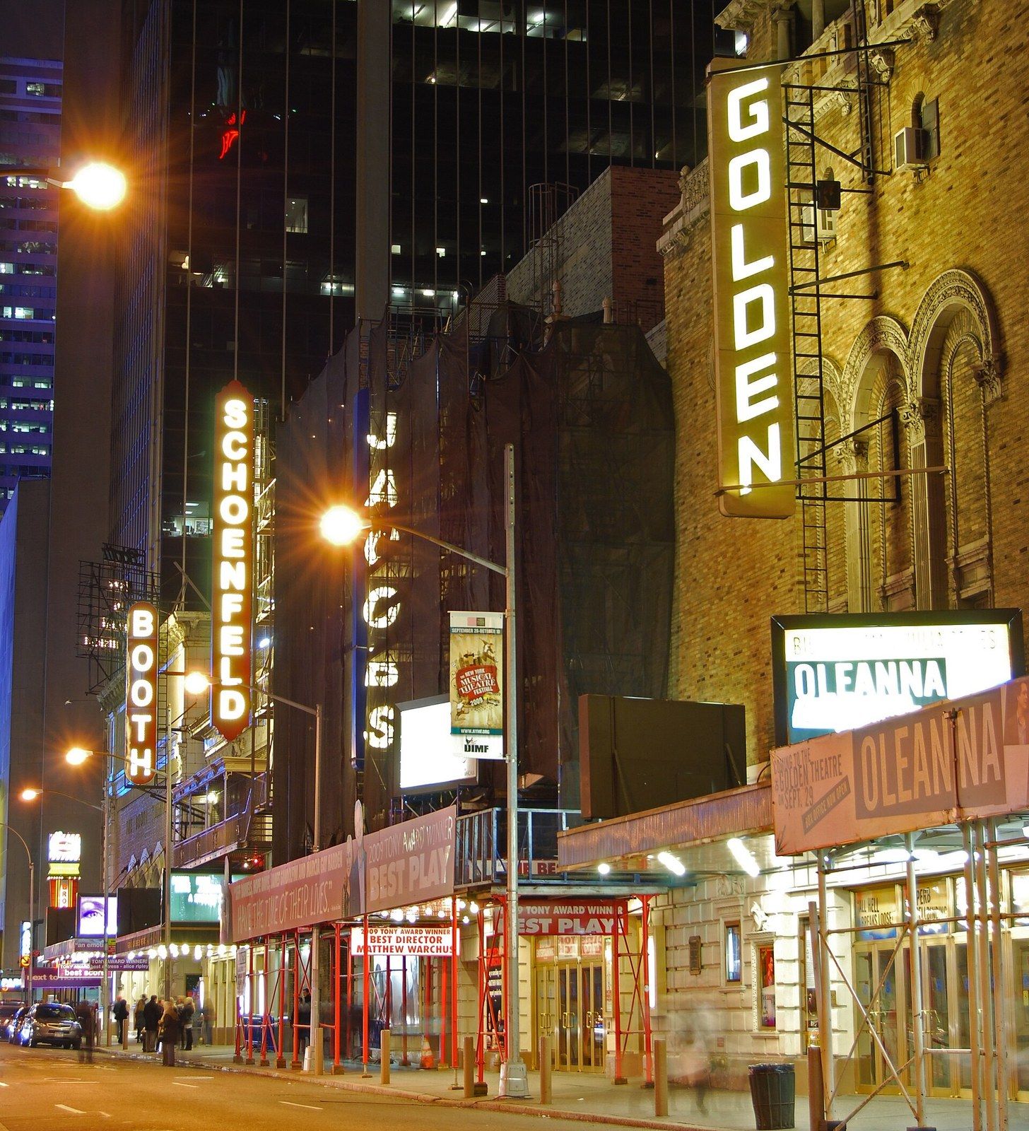 A theatre street at night with lit vertical signs and marquees, a Wikimedia Commons photograph in Michael Stern's encyclopedia