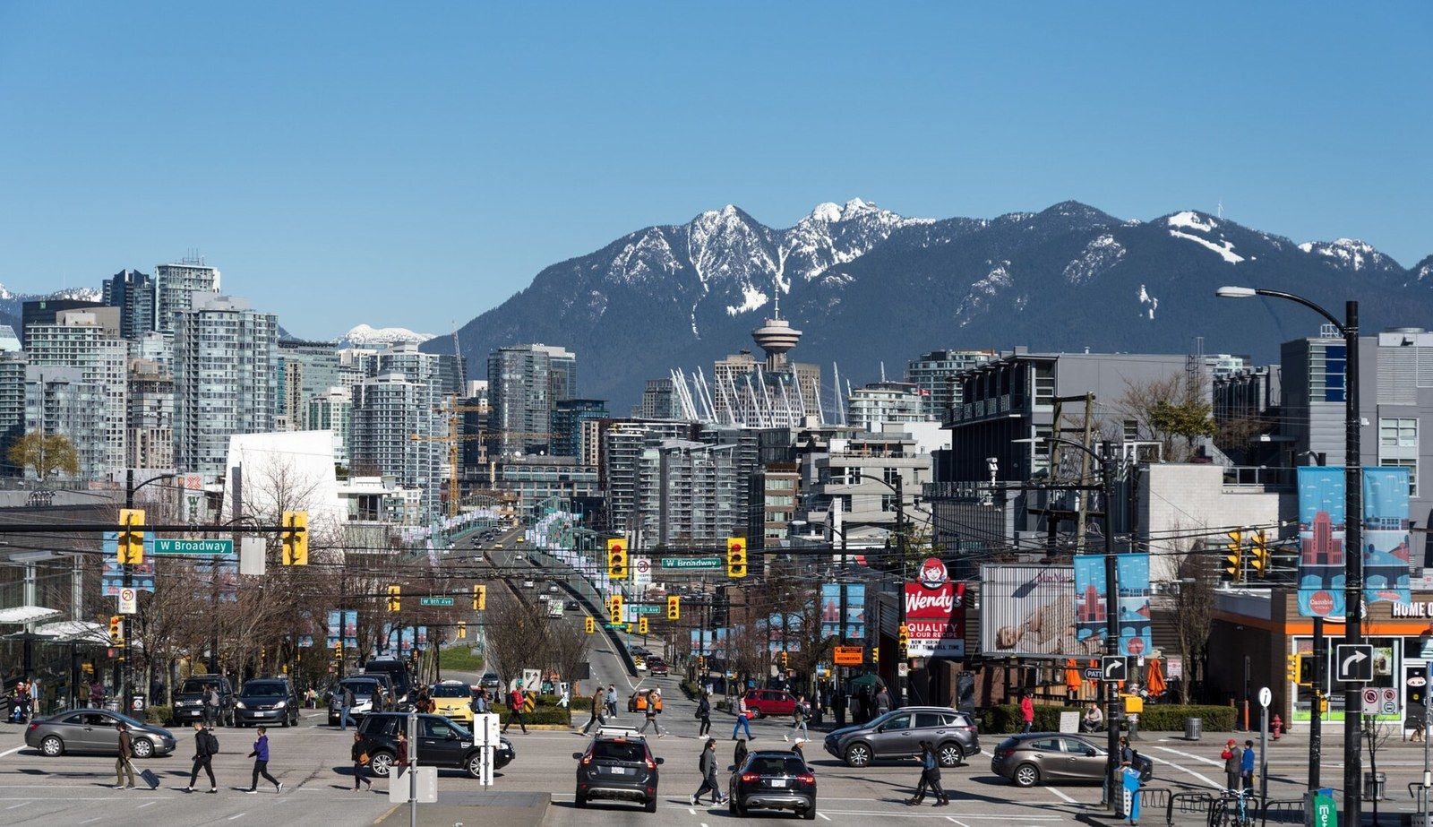 A city street with towers either side framing a view of snow capped mountains, a Wikimedia Commons photograph in Michael Stern's encyclopedia
